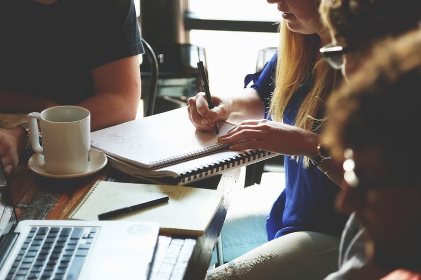 A startup team reviewing a portfolio of work
