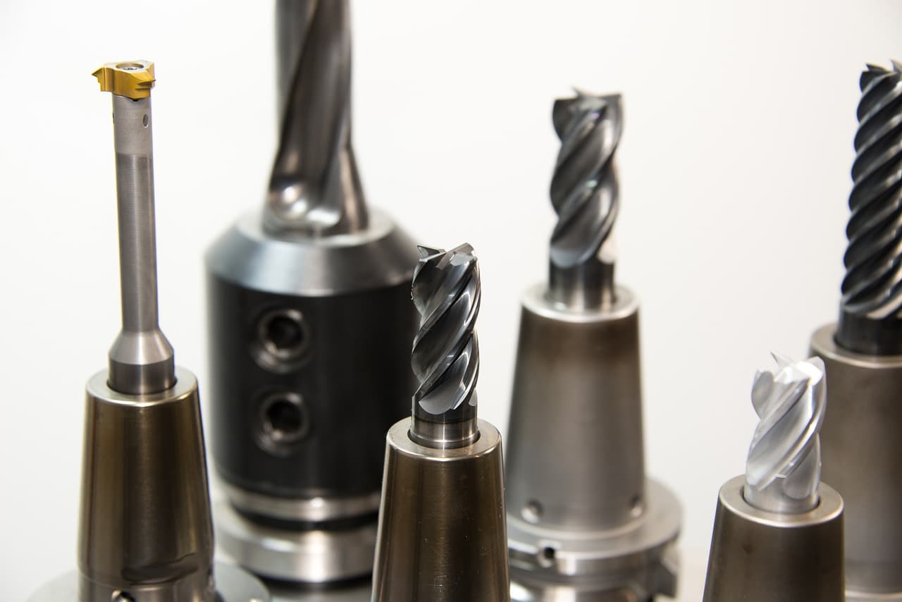 A row of cutting tools standing upright in their holders